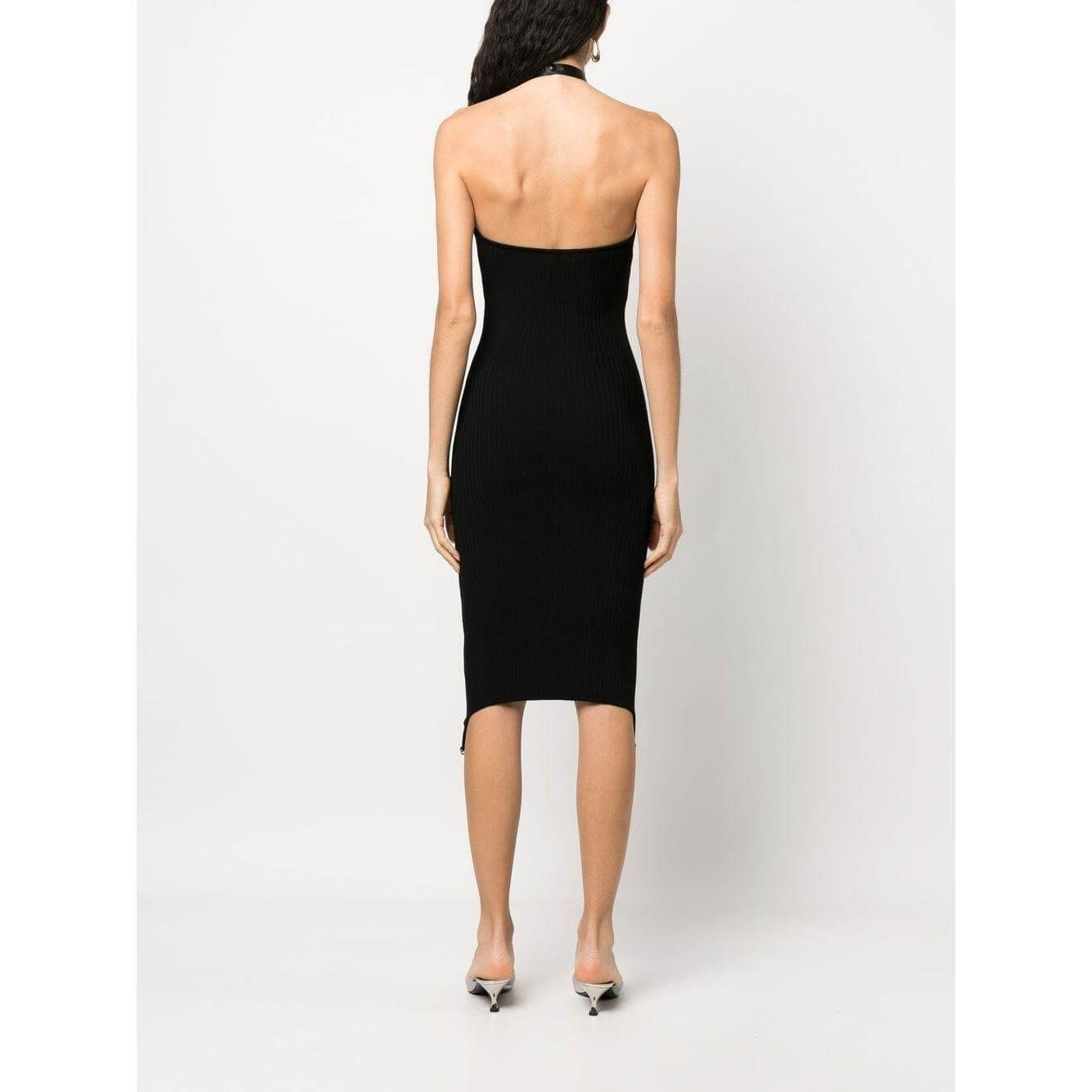 Back view of Courreges black halterneck bodycon dress with open back and below-knee length, featuring ribbed knit and ring hardware detail.