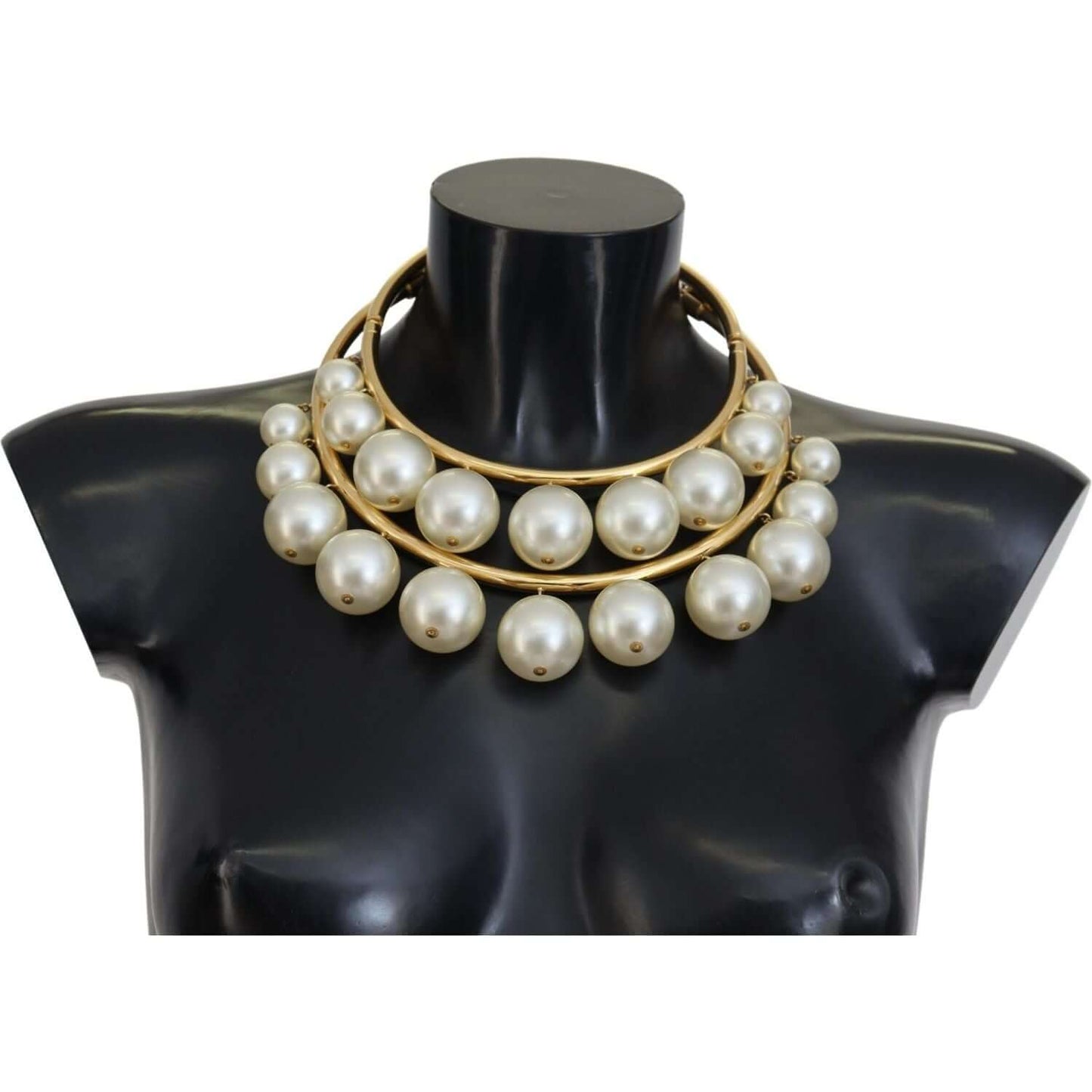 Dolce & Gabbana gold choker with faux pearl embellishments on black mannequin bust, luxury jewelry display
