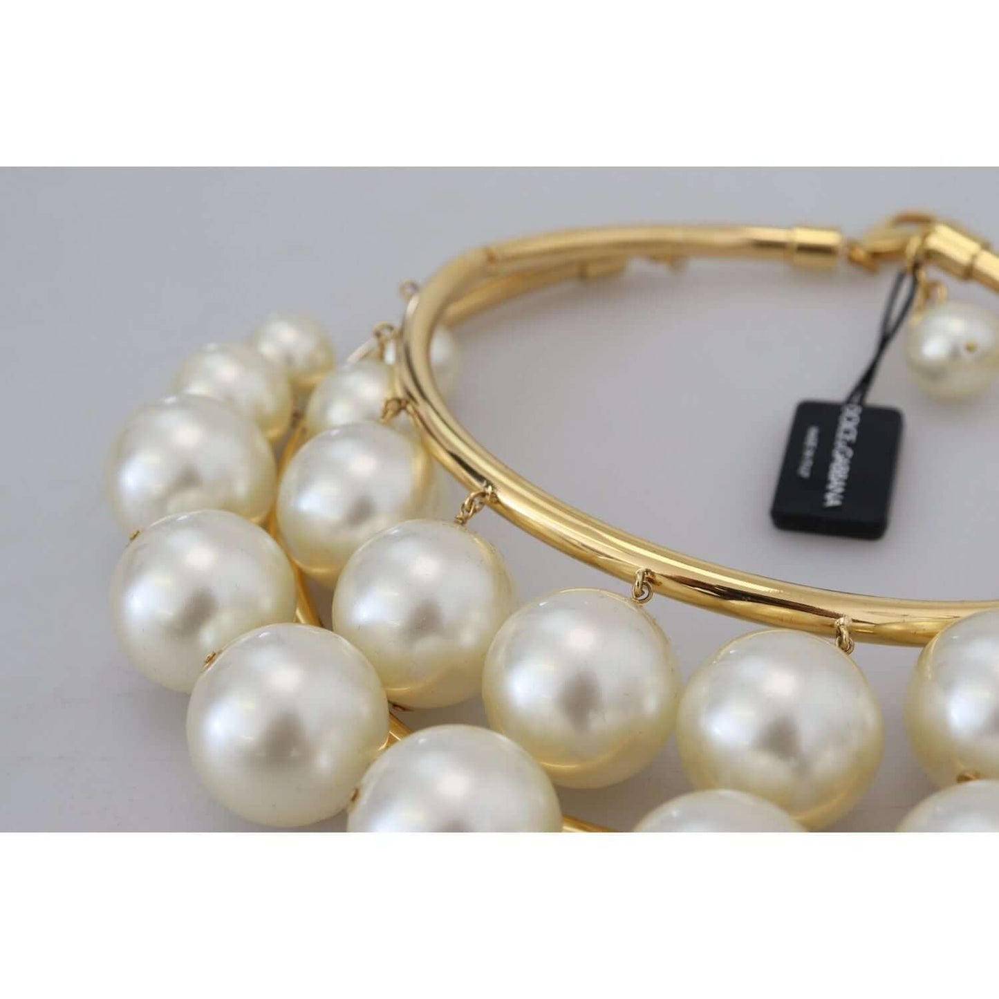 Dolce & Gabbana gold choker with faux pearl embellishments, showcasing luxury design and high-quality craftsmanship.