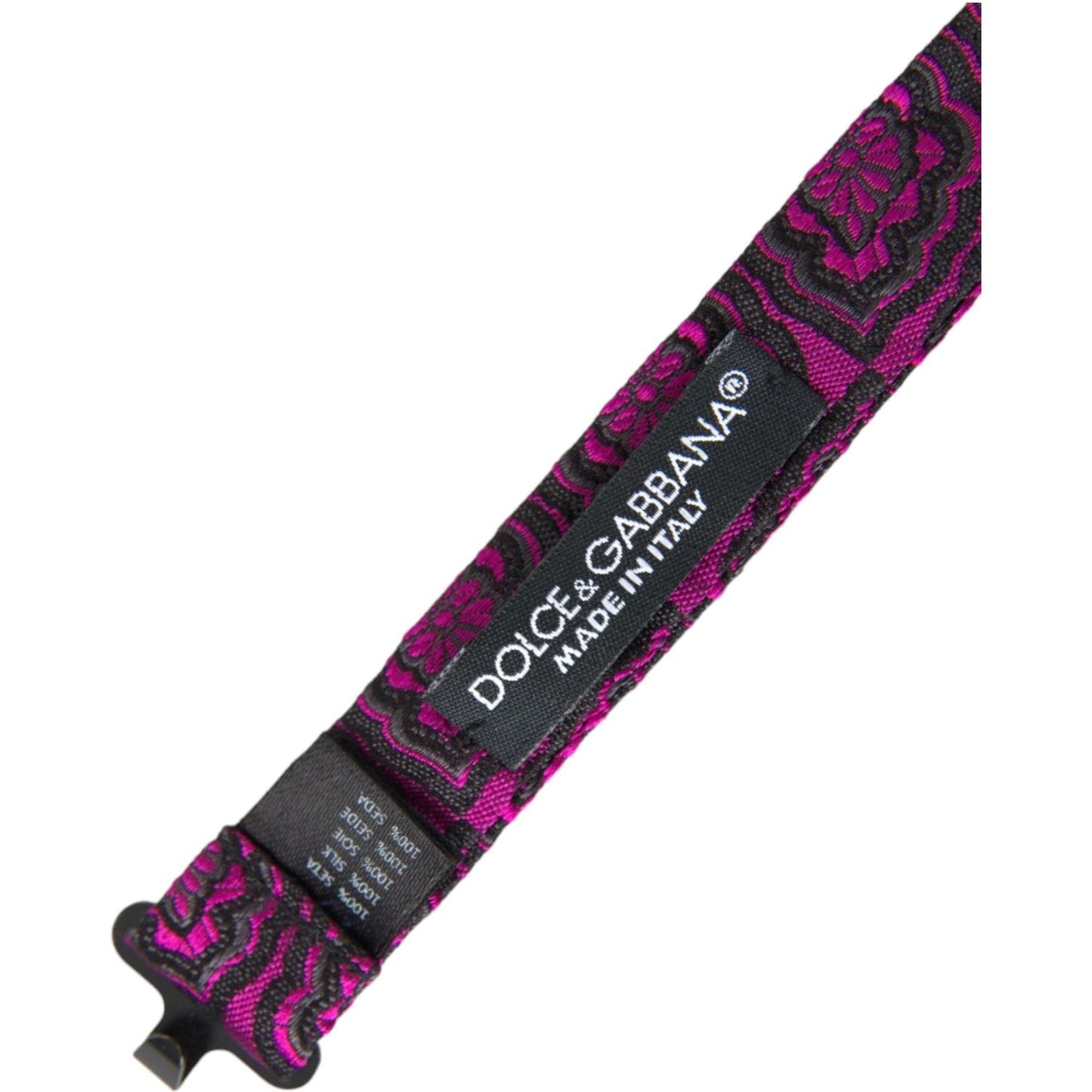 Dolce & Gabbana purple silk bow tie with ribbon detail and adjustable neck strap, featuring brand logo tag. Made in Italy.