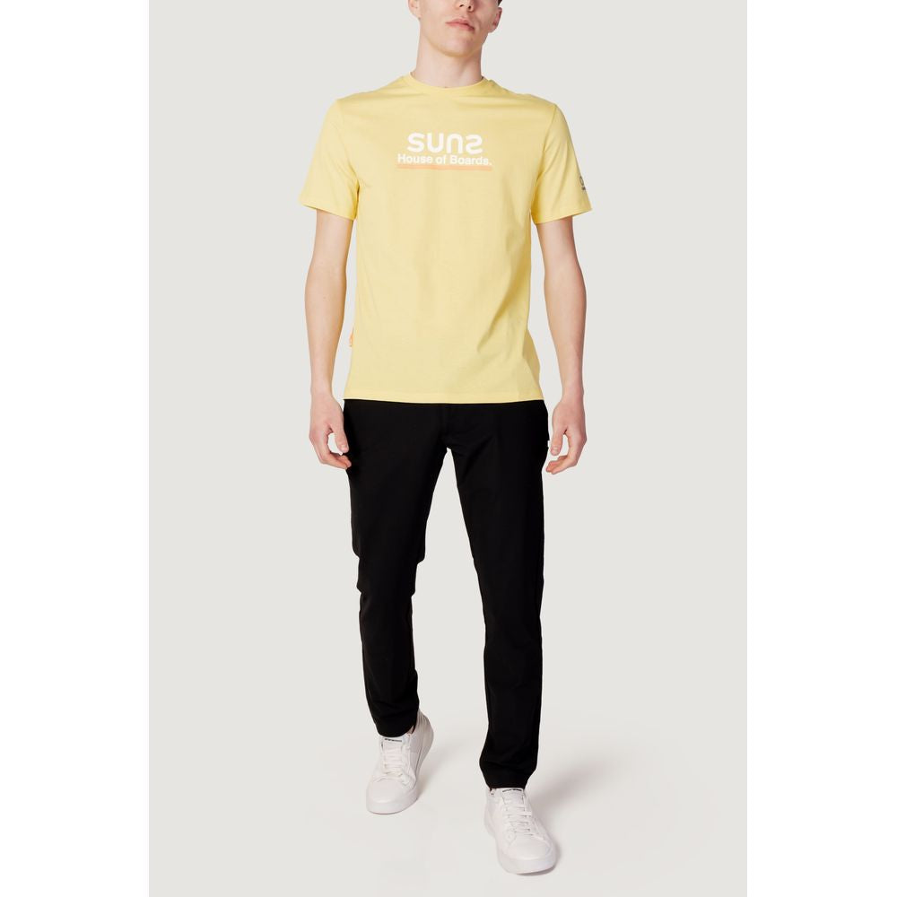 Men's spring summer yellow cotton T-shirt by Suns, front view, paired with black pants and white sneakers for casual style.