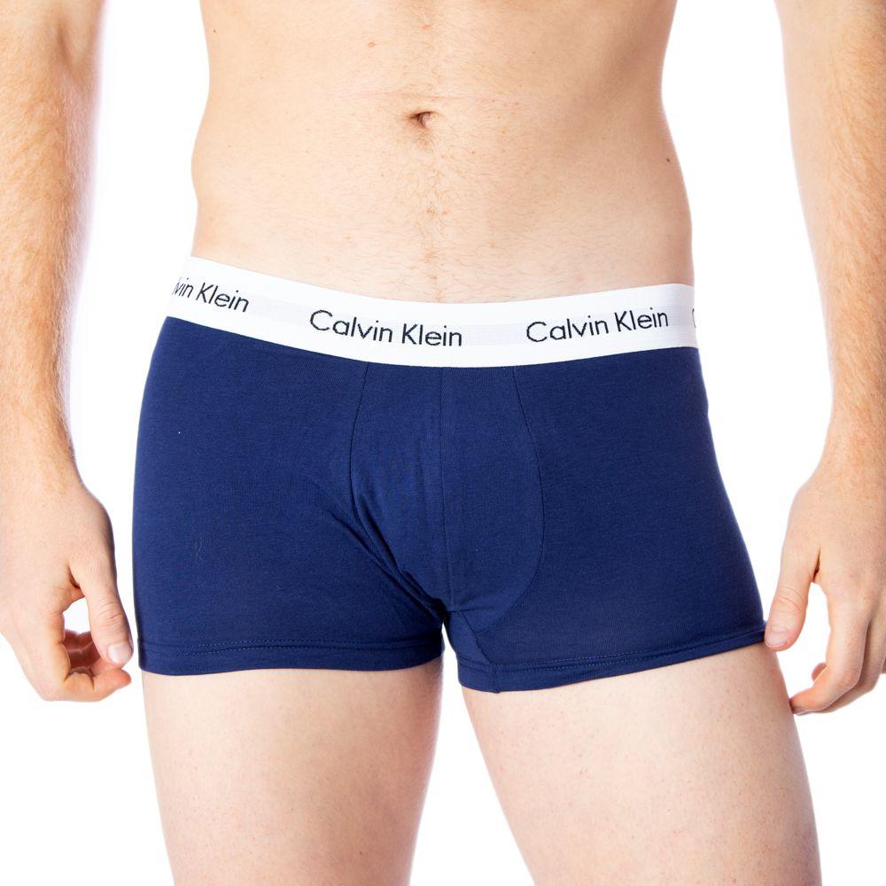 Calvin Klein men's blue boxer shorts with logo waistband, providing comfort and style, made of cotton and elastane blend.