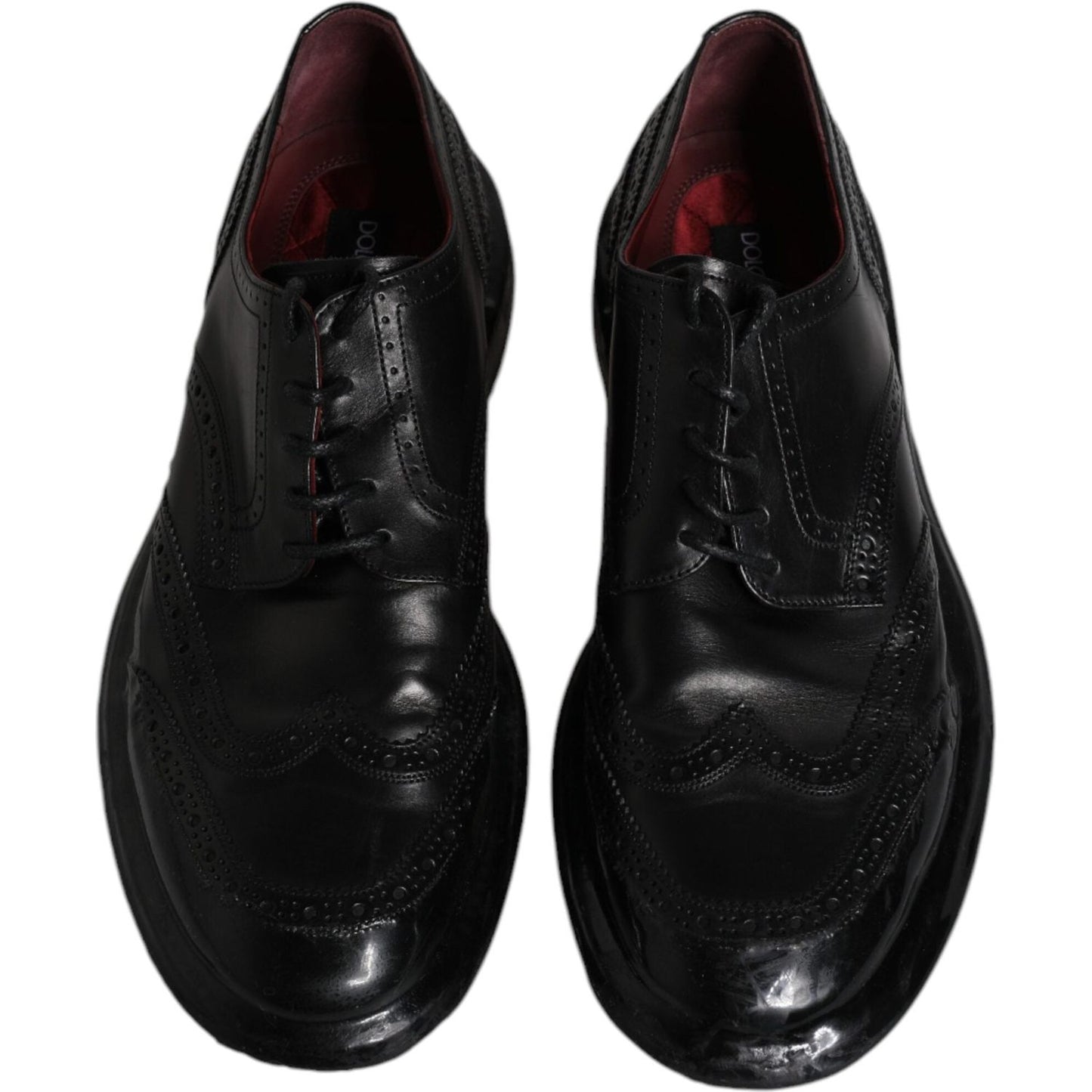 Dolce & Gabbana black leather derby wingtip formal shoes, elegant calfskin with lace-up closure, Italian craftsmanship.