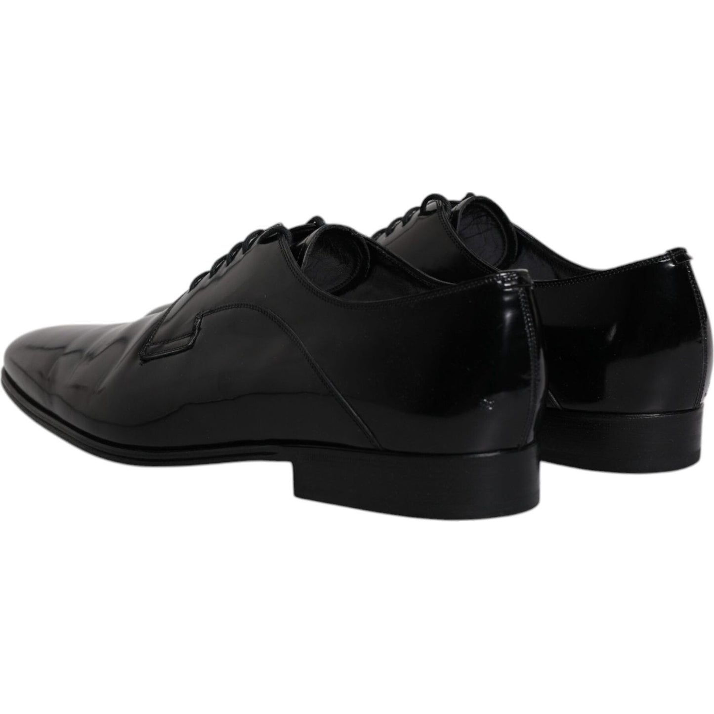 Dolce & Gabbana black leather lace-up Derby dress shoes, side view, showcasing sleek design and high craftsmanship, made in Italy.