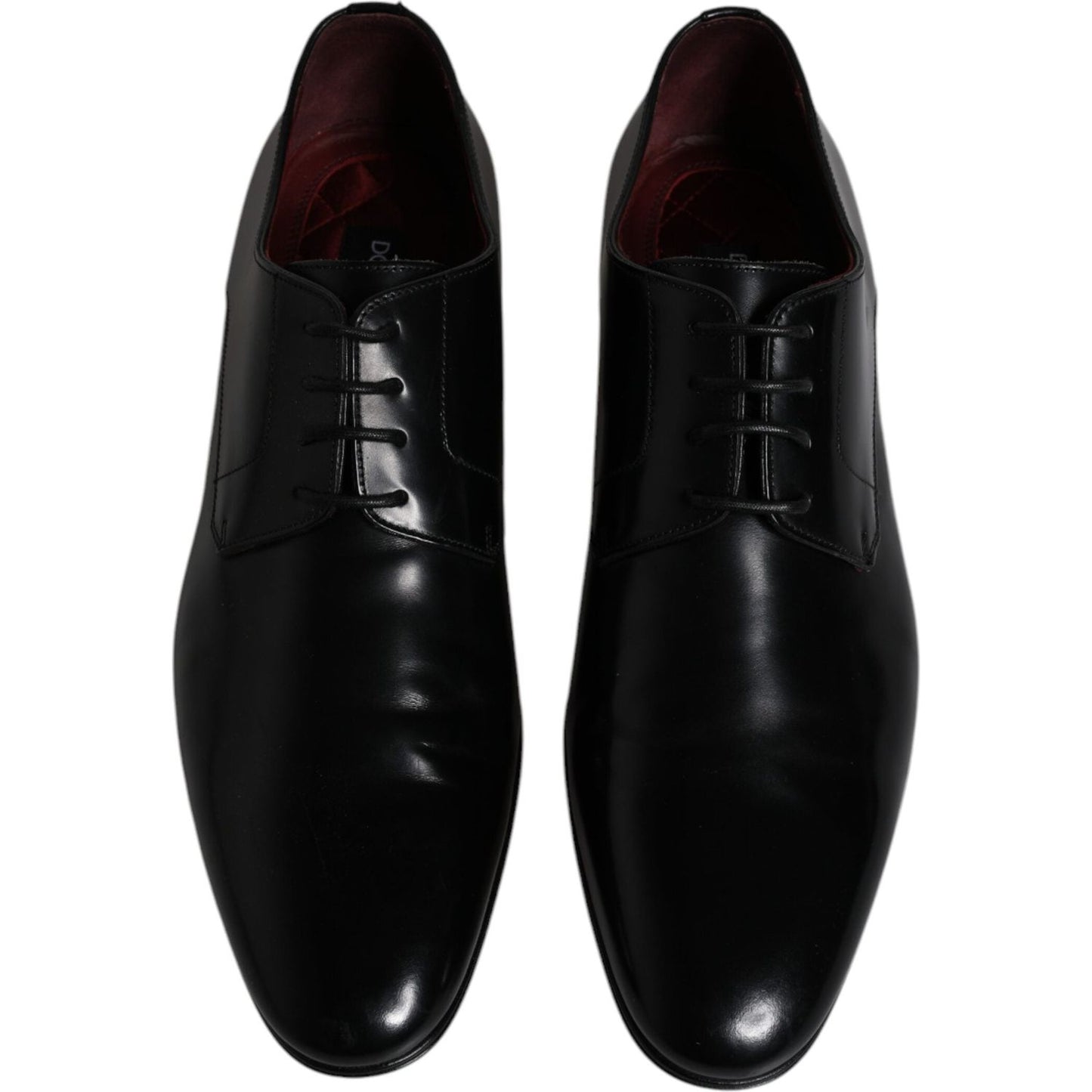 Dolce & Gabbana black leather men's Derby shoes, lace-up, formal, crafted in Italy, displaying brand craftsmanship and luxury.
