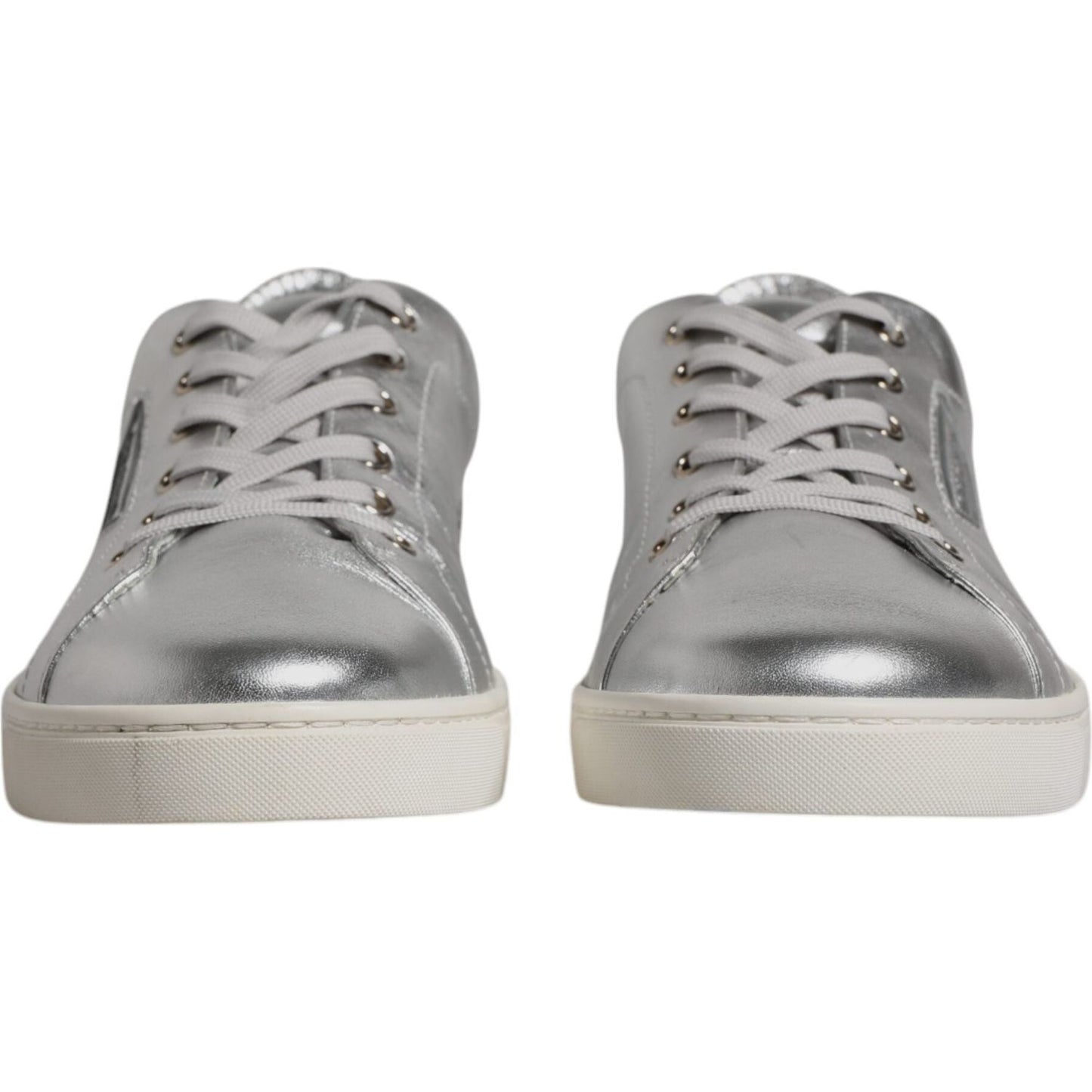 Dolce & Gabbana silver leather low top sneakers with lace-up closure and rubber sole, crafted in Italy, front view.