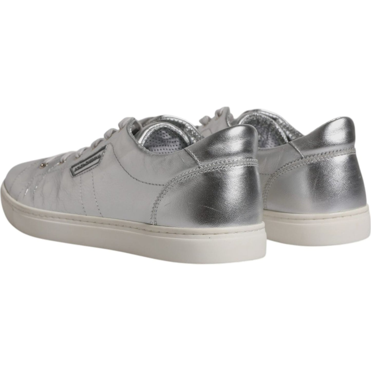 Dolce & Gabbana men's low top silver leather sneakers with rubber soles and logo, featuring lace-up closure, photographed from the back.