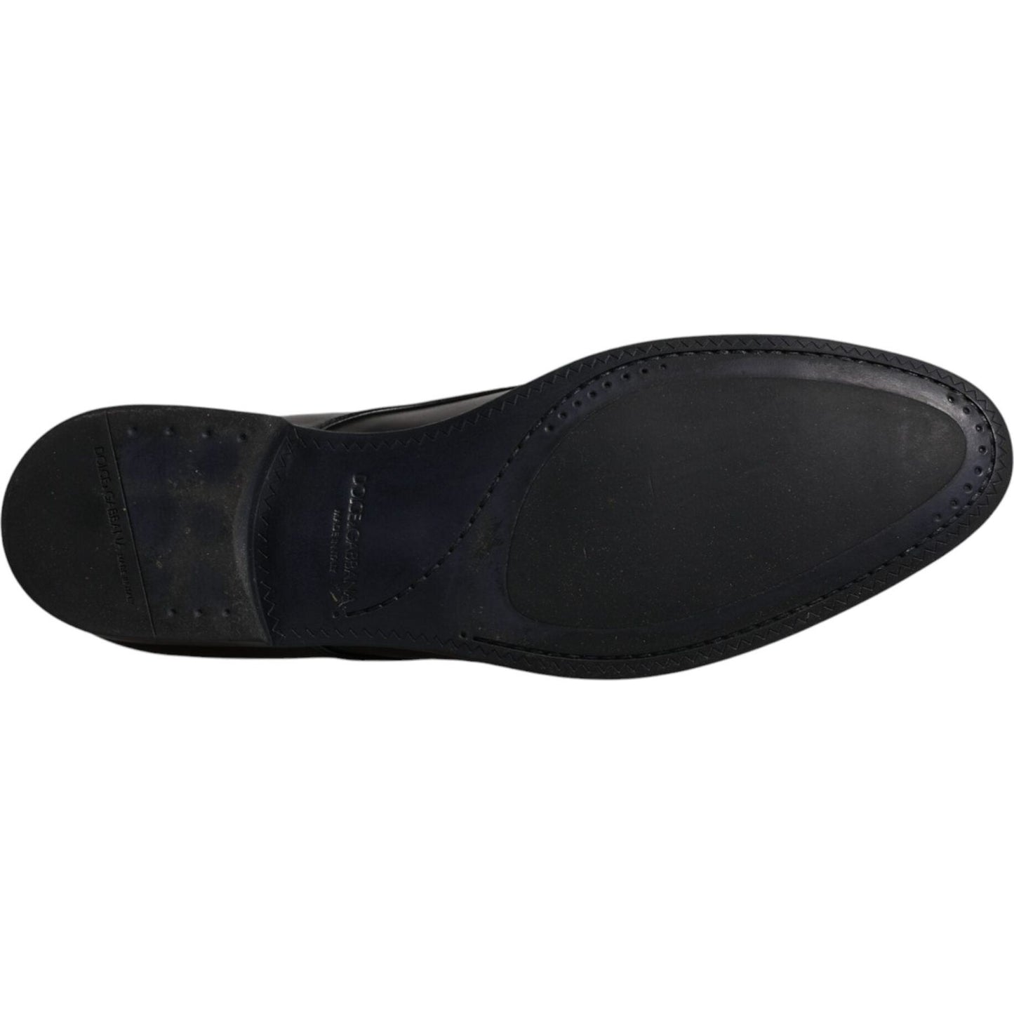 Sole of Dolce & Gabbana black leather men's derby shoe, showcasing craftsmanship and slight wear marks.