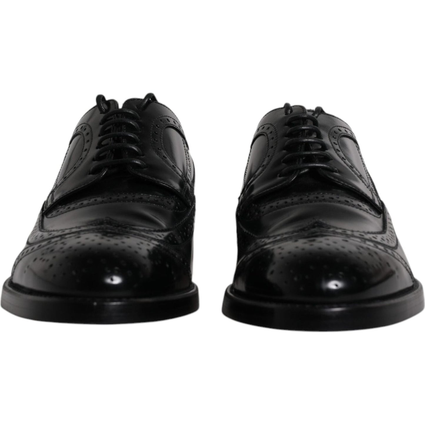 Dolce & Gabbana black leather derby wingtip formal shoes with lace-up closure, crafted from 100% calfskin leather, made in Italy.