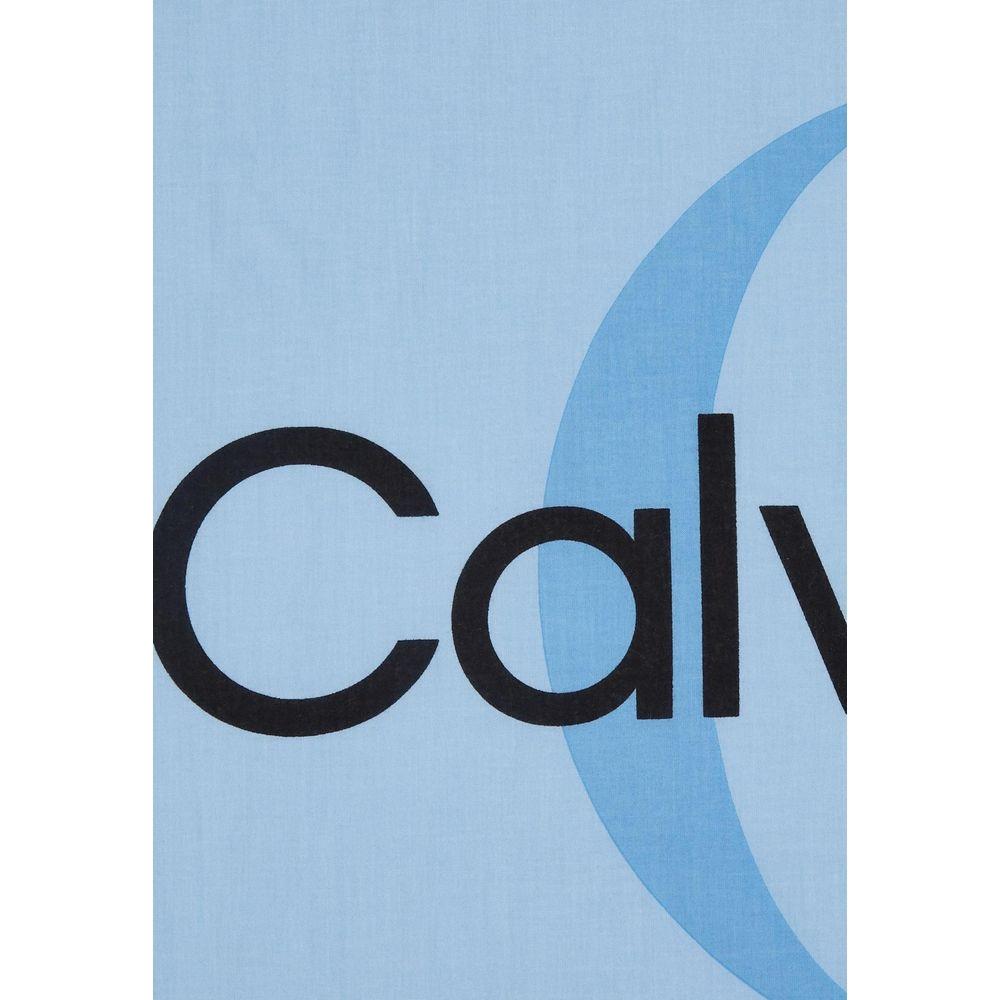 Calvin Klein blue scarf featuring a unique cut-out logo design, made from 100% organic cotton for comfort and style.