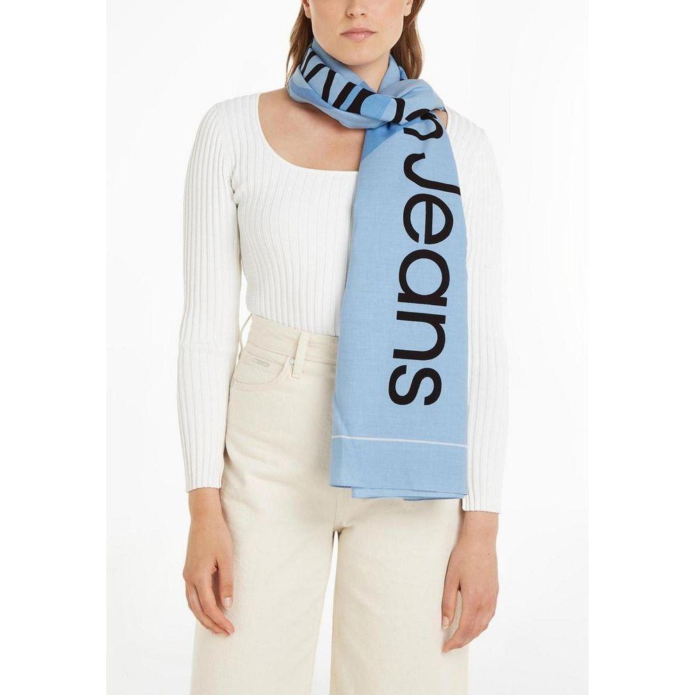 Woman wearing Calvin Klein blue organic cotton scarf with cut-out logo design.
