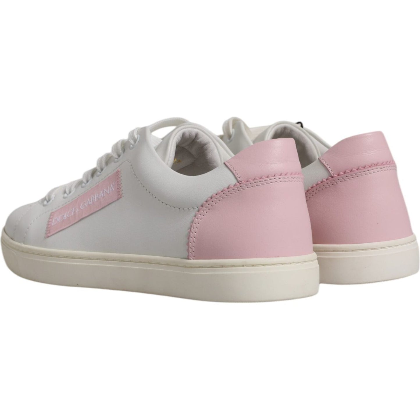 Dolce & Gabbana white leather sneakers with pink detailing, low top design, rubber sole, lace-up closure, logo detail, made in Italy.