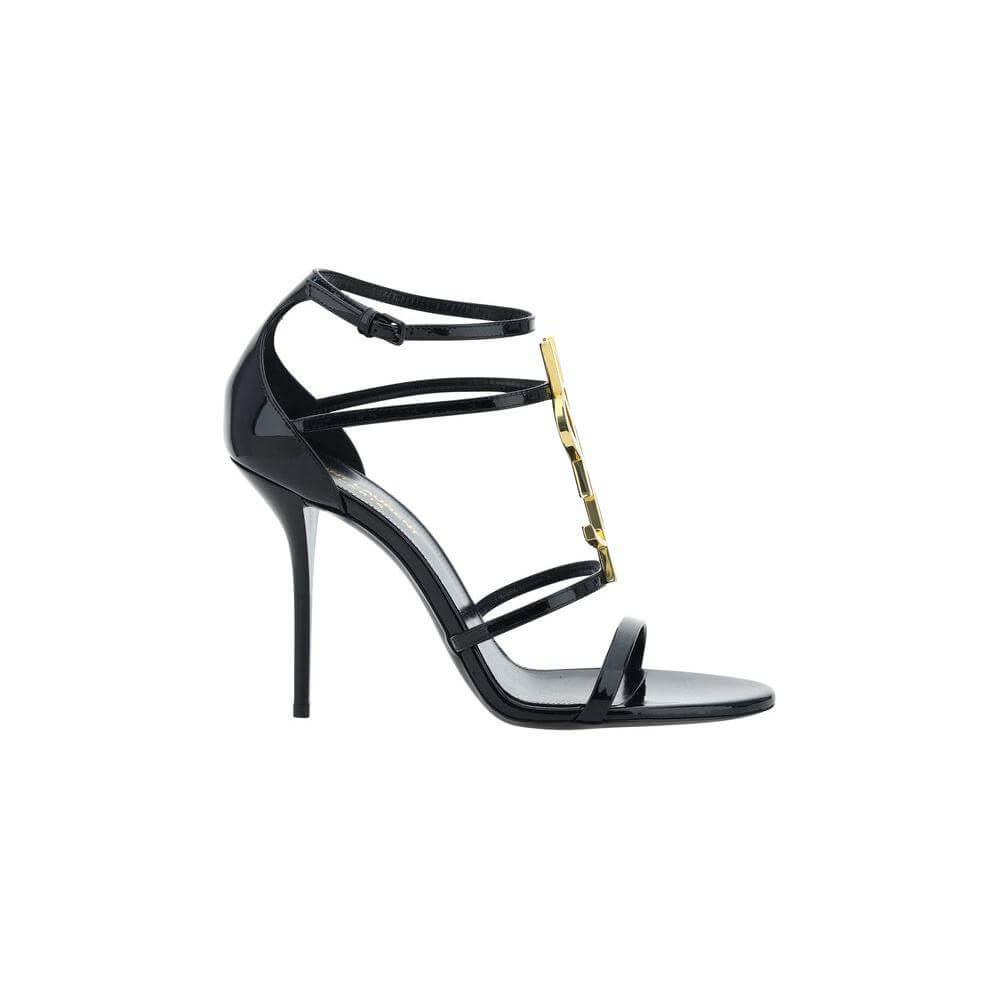 Saint Laurent Cassandra Sandals in calfskin with YSL logo, open front round toe, adjustable ankle strap, and stiletto heel, cage style.