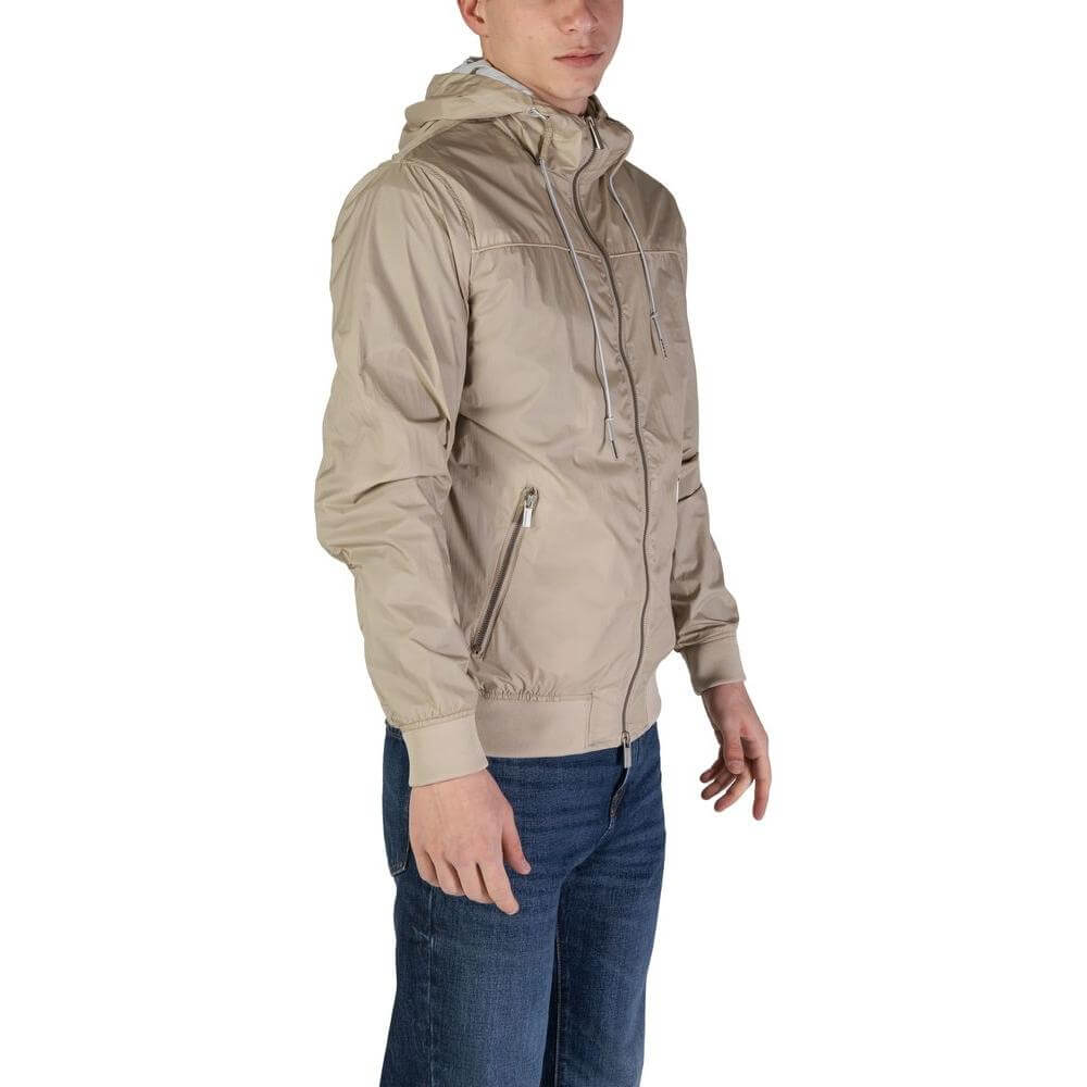 Hamaki-Ho beige nylon jacket for men, fall/winter collection, featuring a hood and zip pockets, perfect for a stylish casual look.