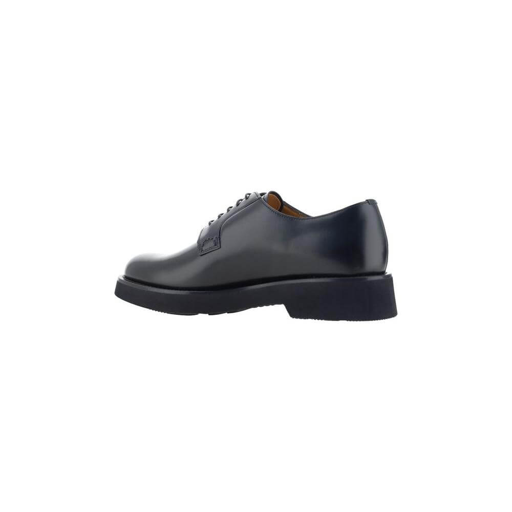 Side view of Church's Shannon Lace-up Shoes in polished leather with block heel, showcasing elegant design and silhouette.