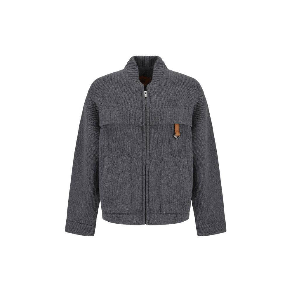MCM Collection wool cardigan with ribbed crew neck, double-slider zipper, and two front pockets in a monochrome design.
