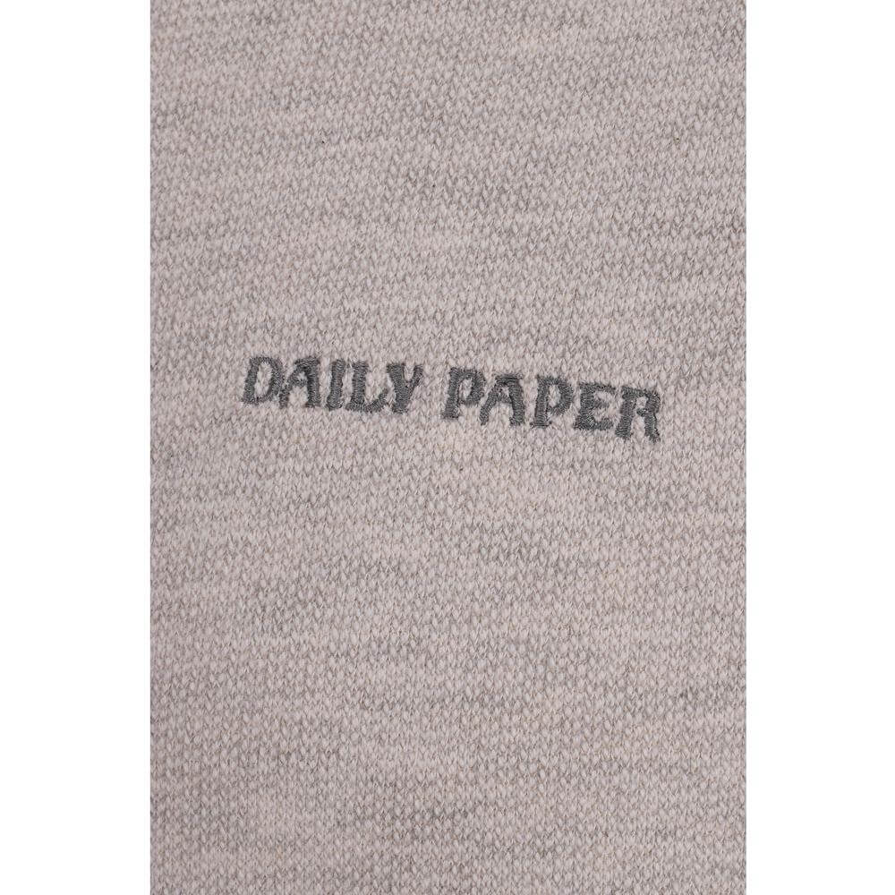 Close-up of Daily Paper Aniola Sweatshirt with mélange pattern and signature logo, ribbed crew neck, raw cut hem and cuffs.