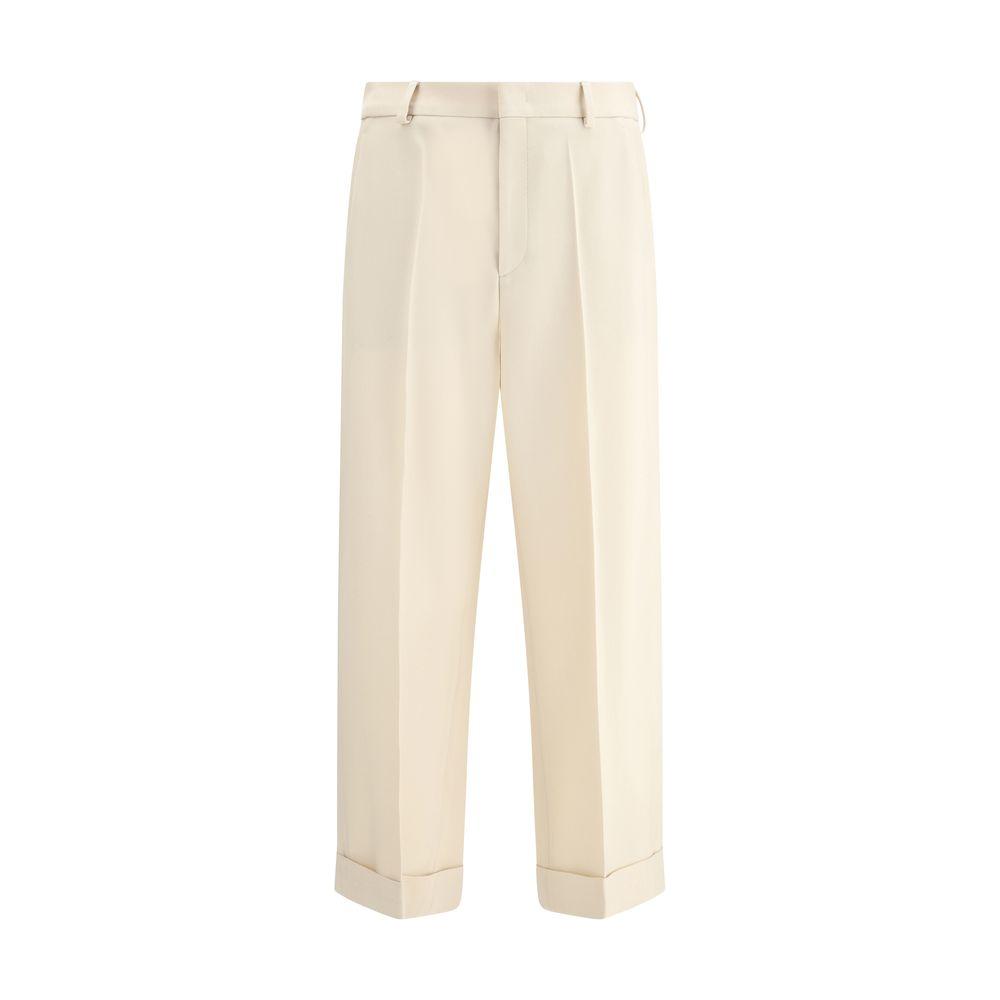 Valentino wide-leg virgin wool pants with front zipper, hook-and-eye closure, side welt pockets, back slit pockets, and turned-up hem.