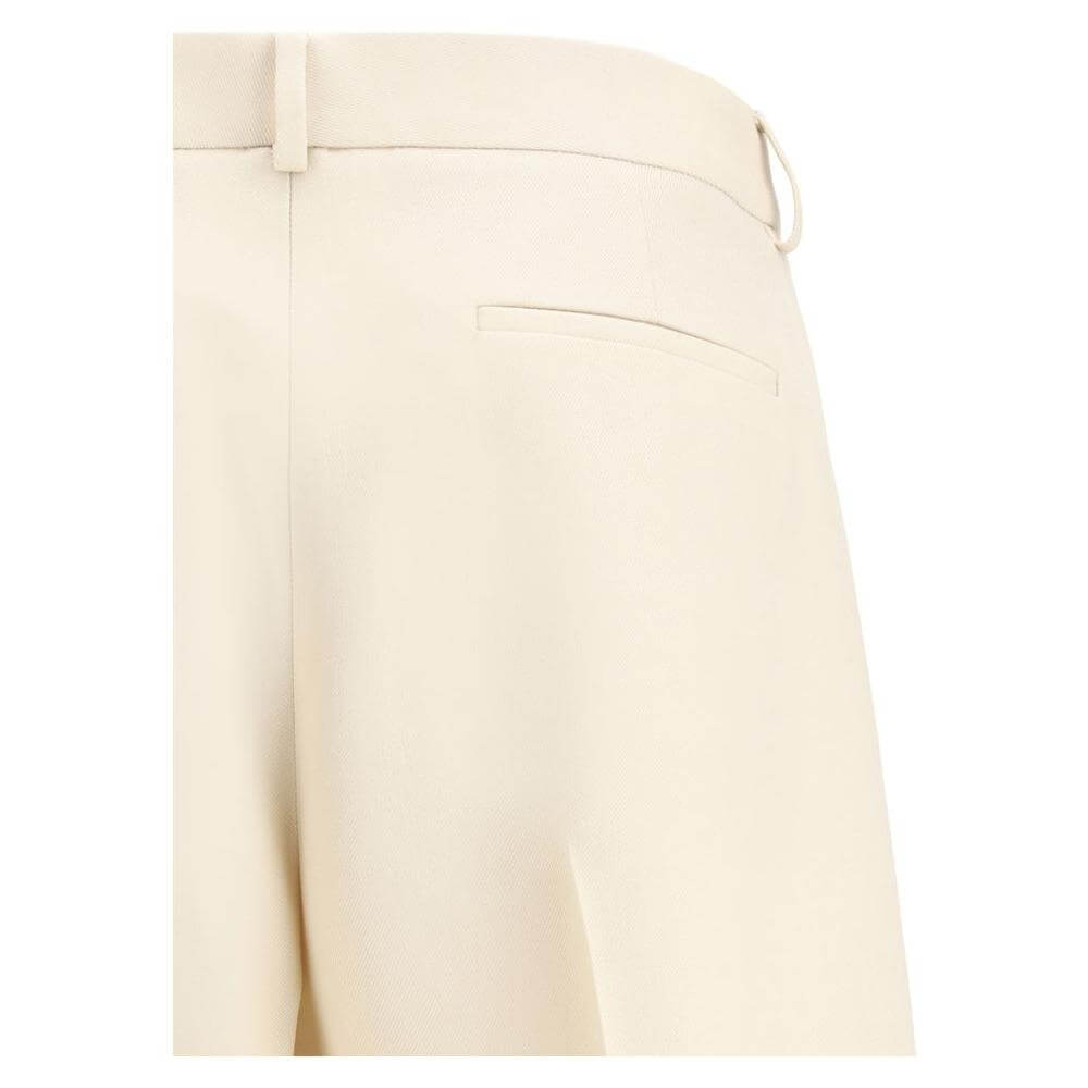 Valentino virgin wool pants, wide-leg design with back slit pocket, beige color, featuring turned-up hem and regular fit.