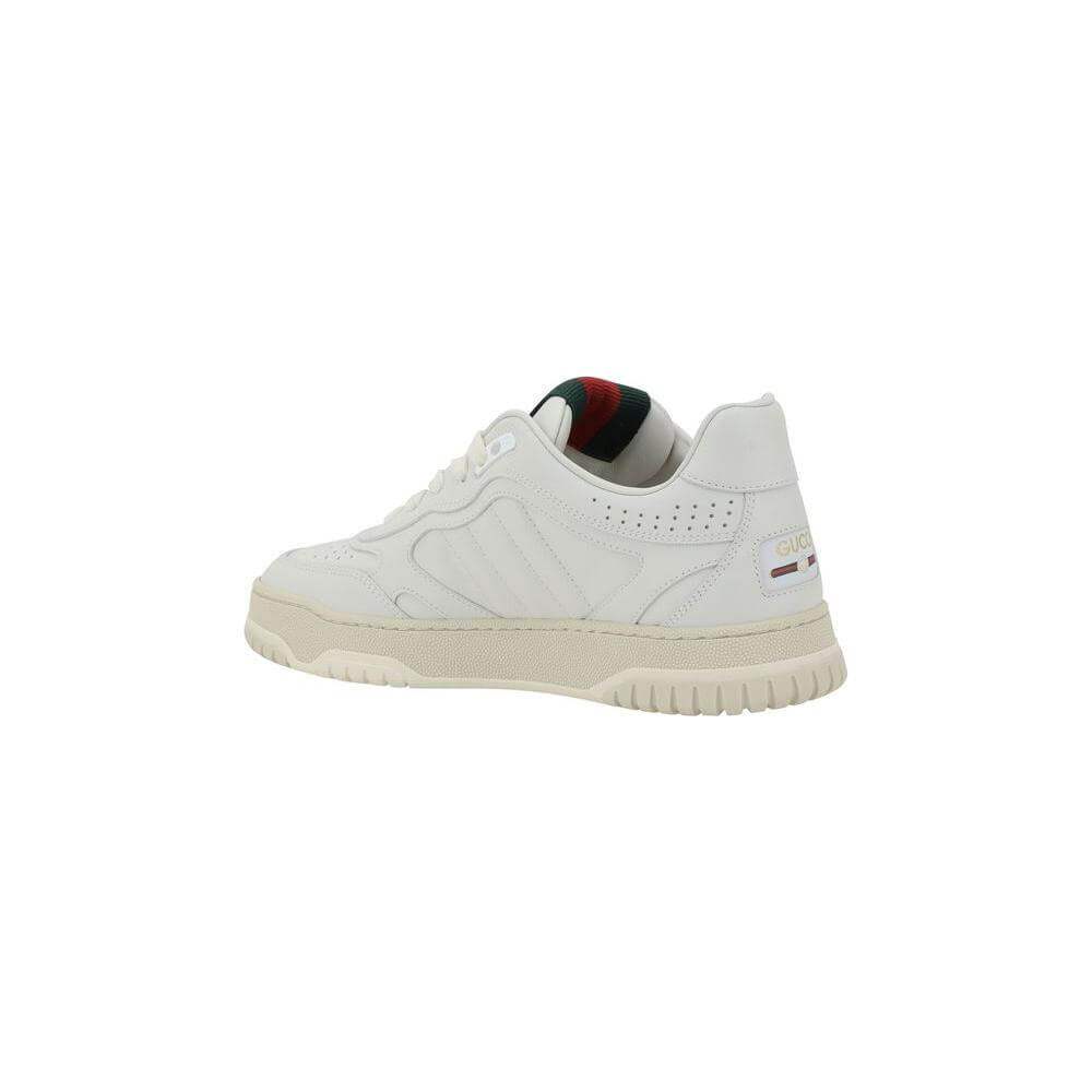 White Gucci Re-Web Sneakers featuring leather upper, printed logo, Nastro Web applique on the tongue, and perforated details.