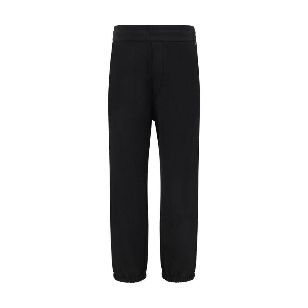 Black Fendi sweatpants with elastic waistband and hems, featuring iconic logo on back, perfect for casual urban style.