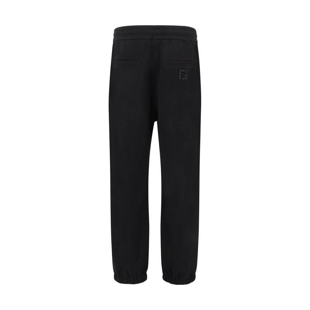 Fendi black sweatpants with elastic waistband, elasticized hems, back welt pockets, and iconic logo for a modern urban style.