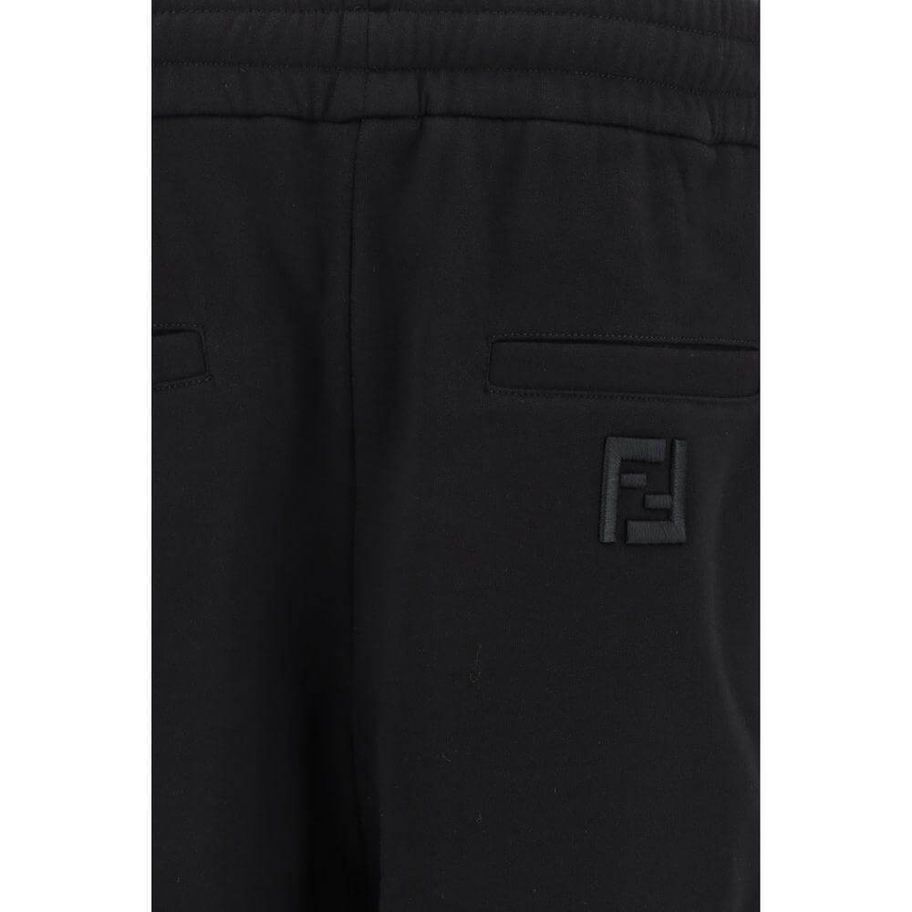 Close-up of Fendi sweatpants showcasing the elasticated waistband and logo detail on back pocket, highlighting style and comfort.