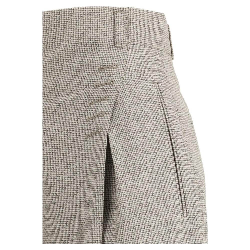 Close-up of Fendi pied-de-poule wool pants showcasing detail stitching and side welt pocket for an elegant, sophisticated look.