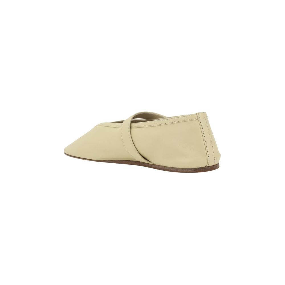 Side view of LE MONDE BERYL Stella Ballerina in beige leather with adjustable strap and flat sole for elegance and comfort.