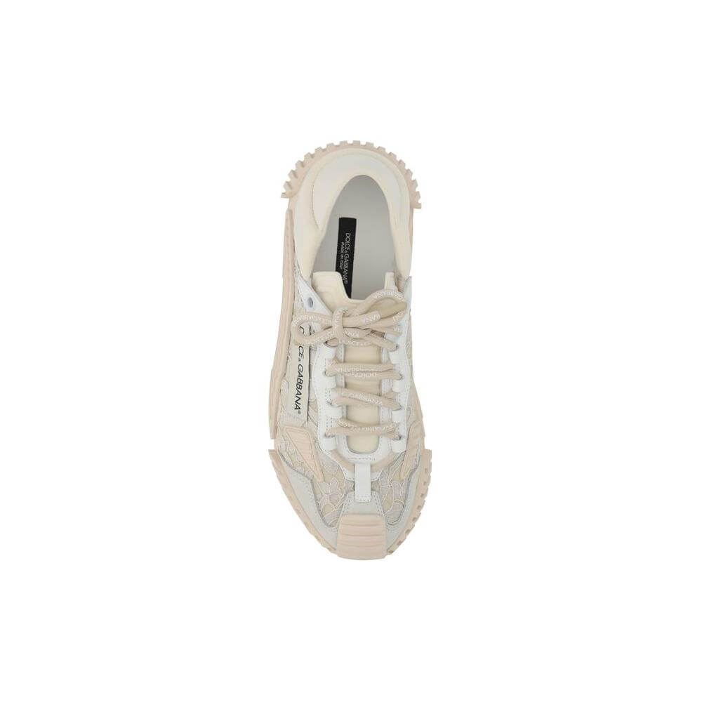 Top view of Dolce & Gabbana sneakers with textured rubber sole, lace and fabric upper, featuring logoed laces and iconic monogram.