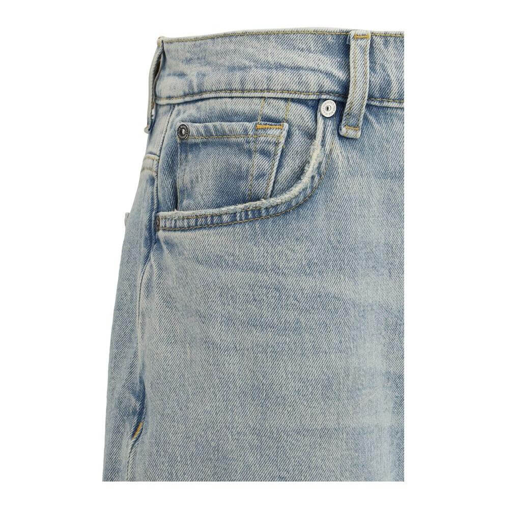 Close-up of 7FOR Spencer Flare Sahara Jeans showcasing mid-rise waist, belt loops, and front pocket detail.