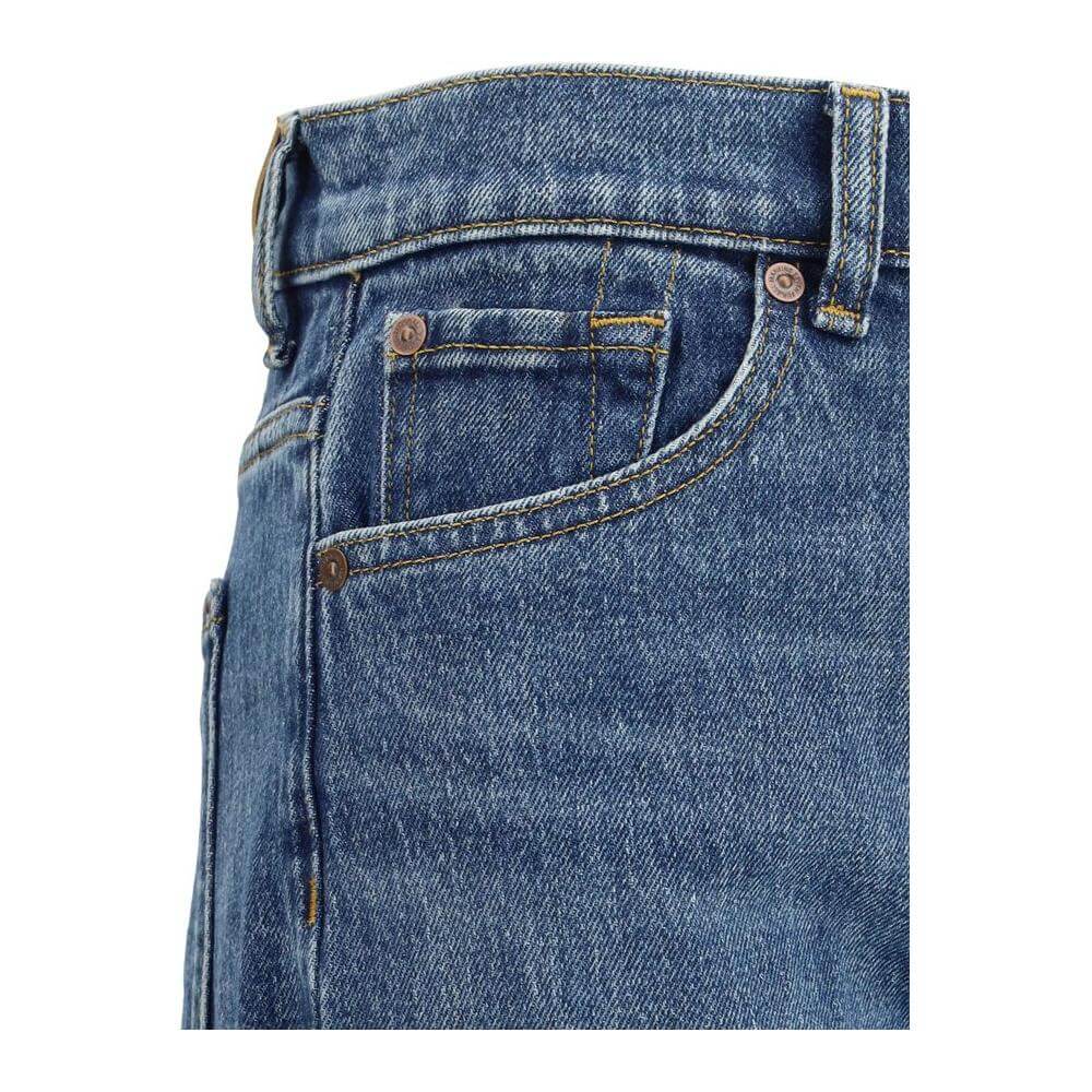 Close-up of 7FOR Jasper Jeans showcasing five-pocket design and blue denim texture with detailed stitching and rivets.