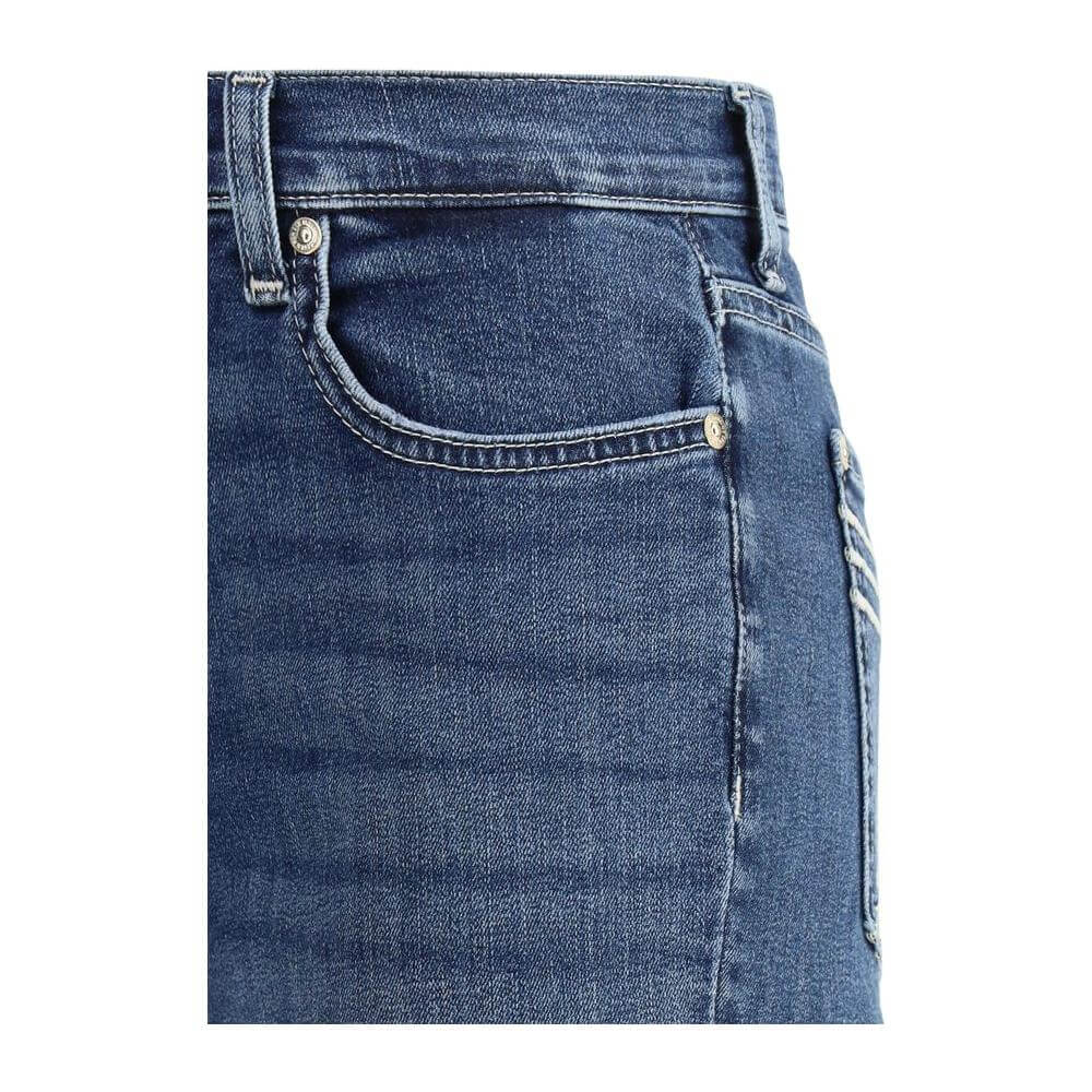 Close-up of 7 For All Mankind flare jeans showcasing cotton texture, five-pocket design, and zipper closure.