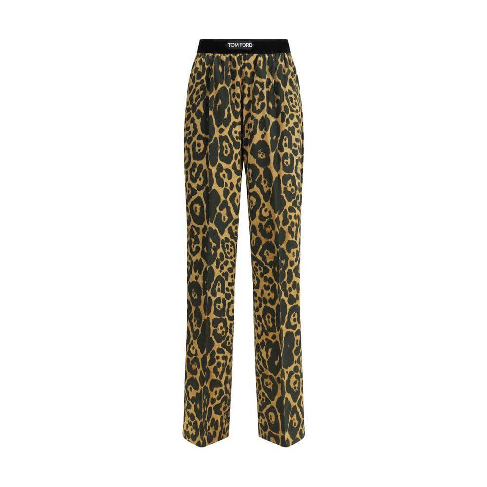 Tom Ford silk pants with animal print and elastic waistband, featuring side welt and back patch pockets for style and functionality.