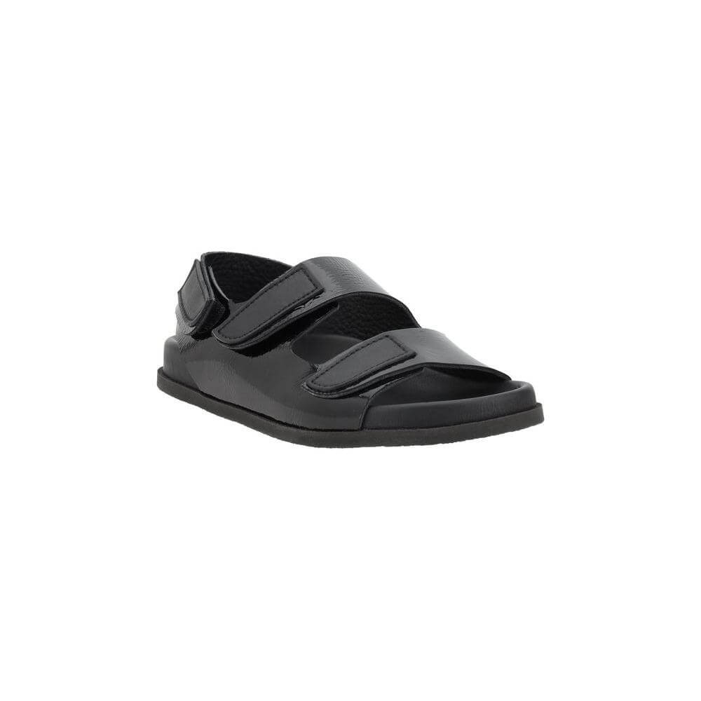 Pedro García Dinka Sandals with black leather and Velcro closure, featuring a round toe and flat sole for comfort and style.