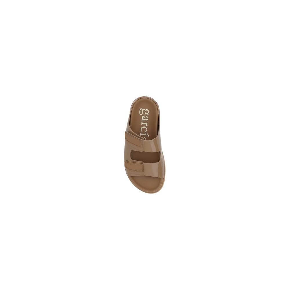 Top view of Pedro García Dominika leather sandal, featuring round toe, adjustable Velcro straps, and logoed insole.
