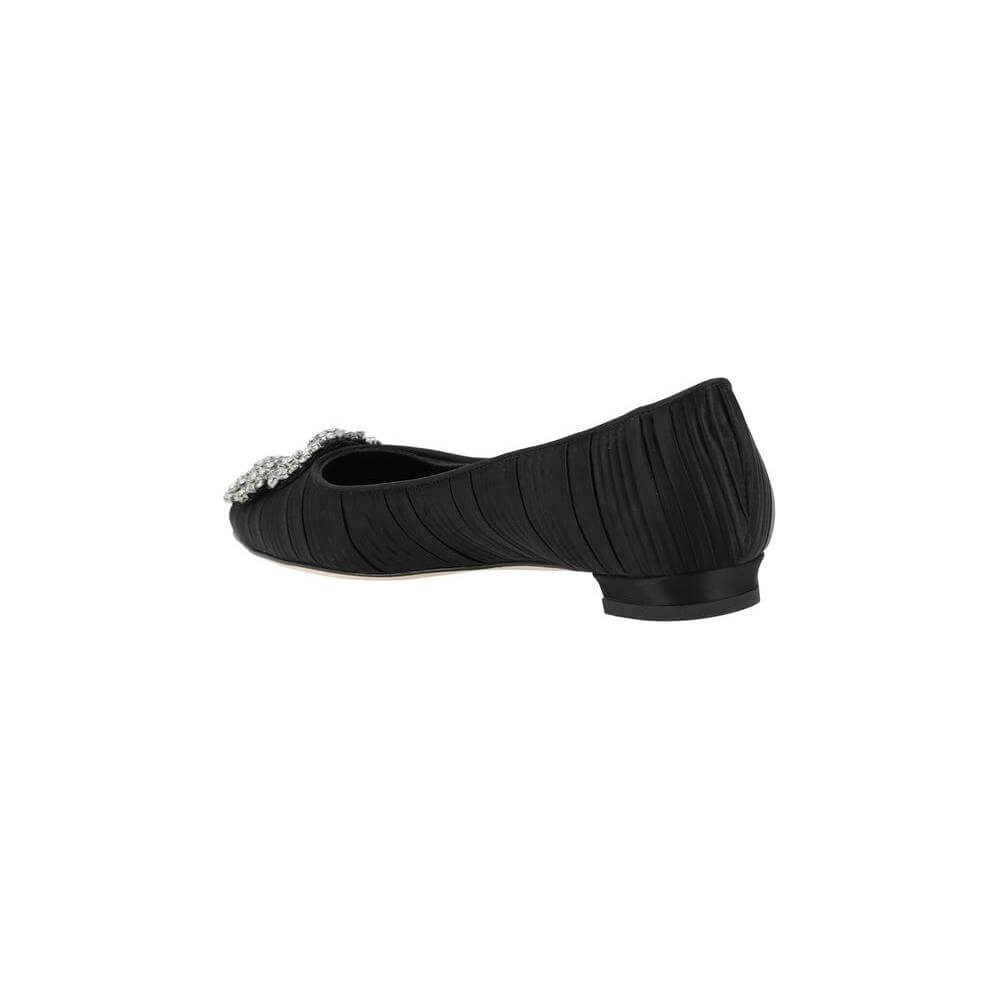 Side view of Manolo Blahnik Hangisiflat Ballerinas in black silk satin with a leather block heel and Swarovski jewel detail.