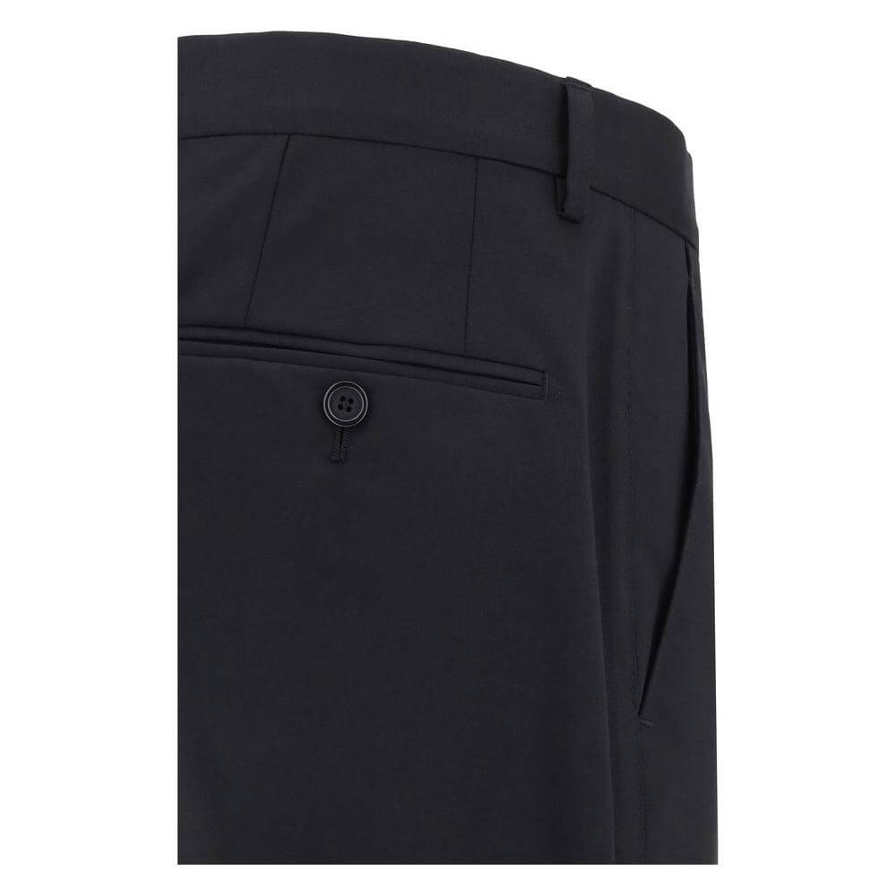 Close-up of Dolce & Gabbana wool suit pants showing back pocket detail and structured tailoring.