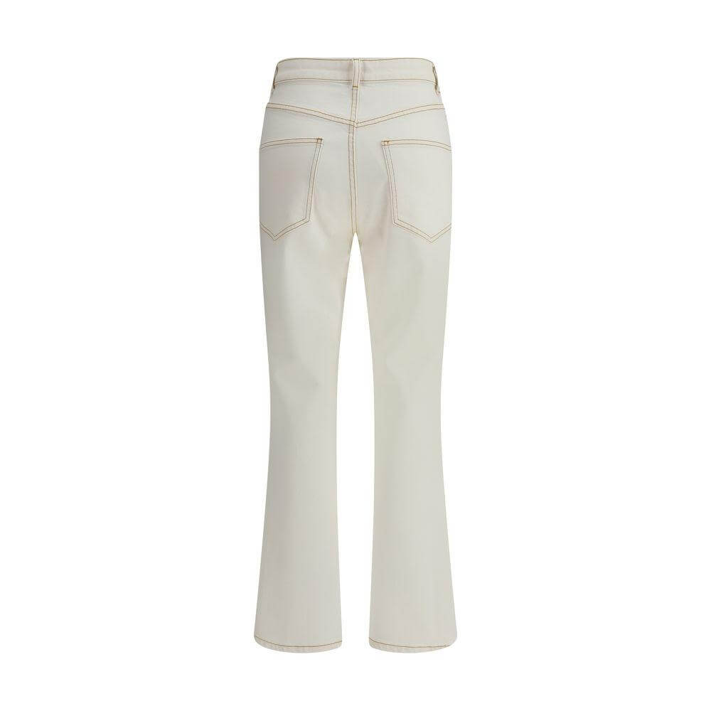 Back view of Tory Burch cropped flare jeans with waistband loops and classic five-pocket design, featuring a stylish and comfortable cut.