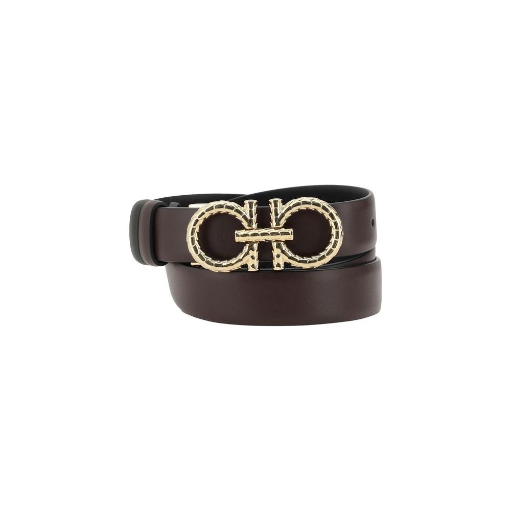 Ferragamo reversible leather belt with iconic Gancini buckle, showcasing luxury and versatility with a double-sided design.