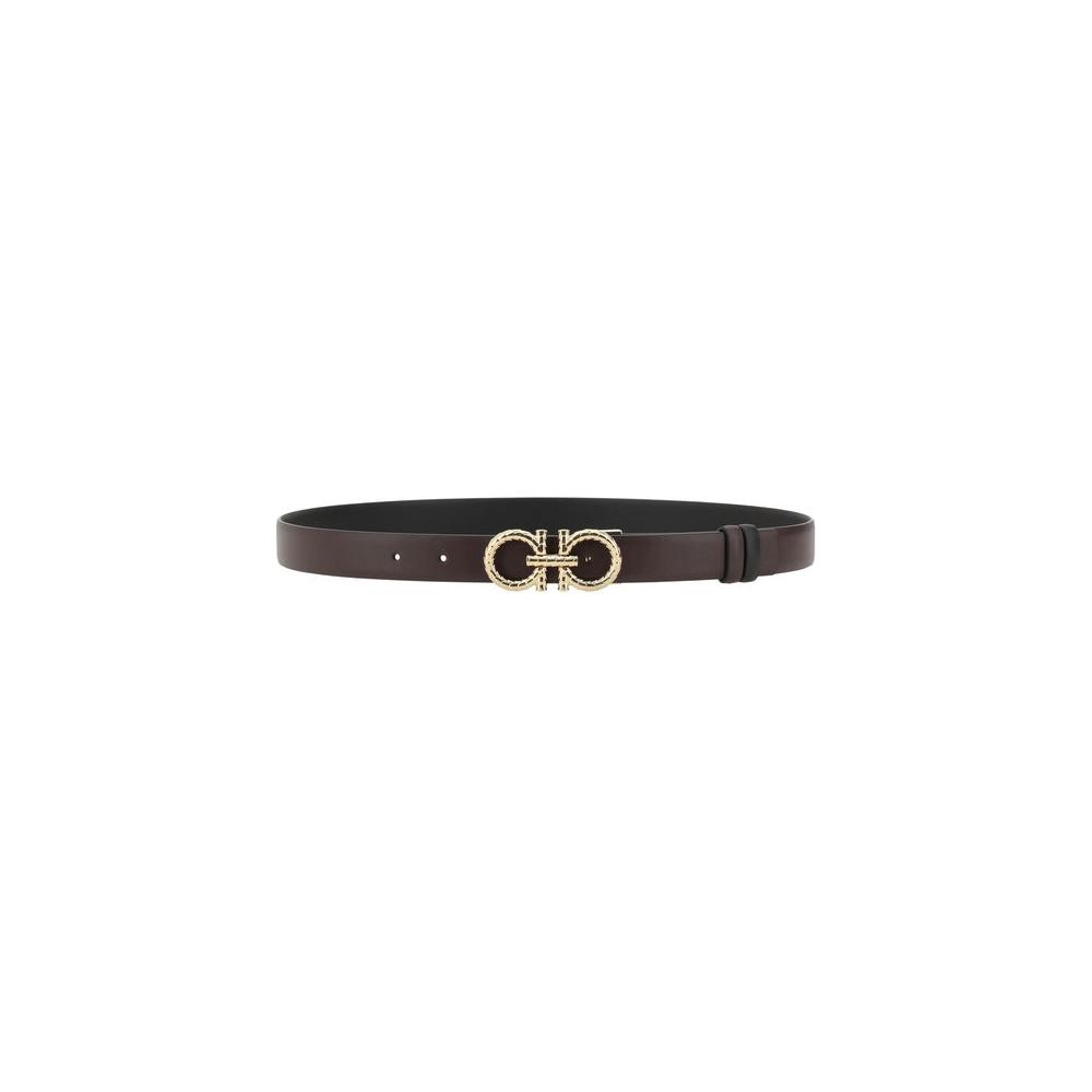 Ferragamo reversible leather belt with iconic Gancini buckle, showcasing luxury and versatility in elegant monochrome and bold design.