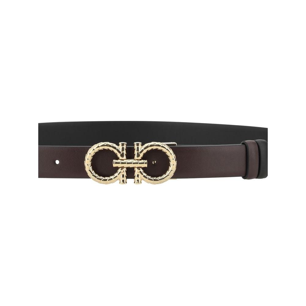 Ferragamo reversible leather belt with iconic Gancini buckle, featuring elegant monochrome and bold side options for versatile styling.