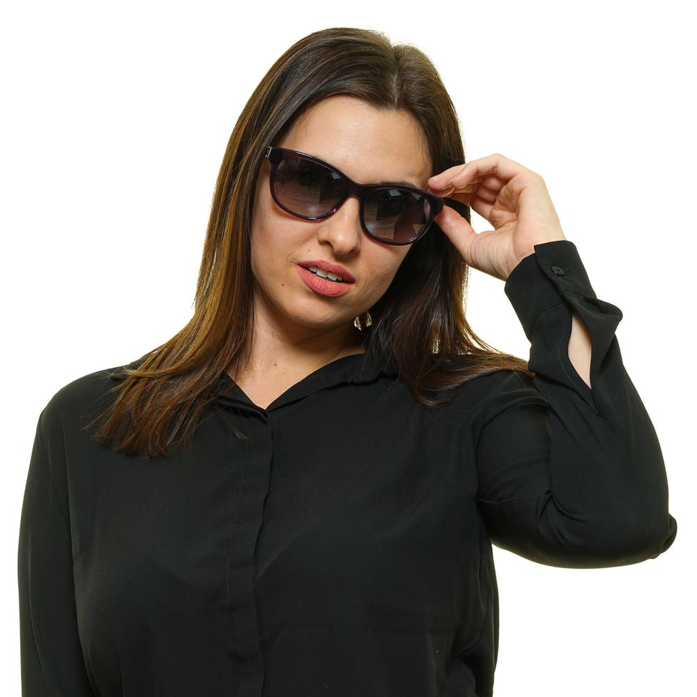 Woman wearing Harley-Davidson purple butterfly sunglasses with grey gradient lenses, offering 100% UVA & UVB protection.
