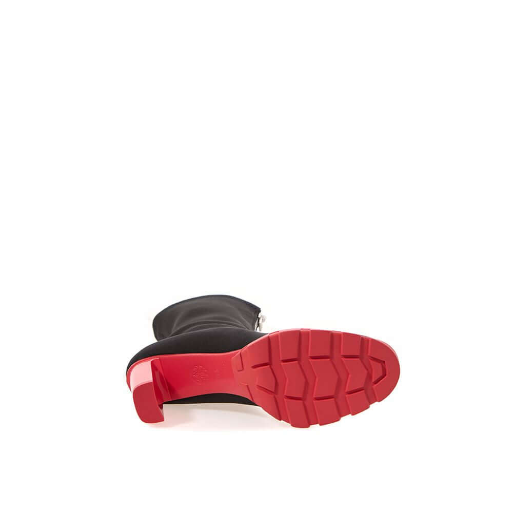 Alexander McQueen Black Neoprene Boot with red sole, featuring sock style, 10cm heel, and zipper fastening.