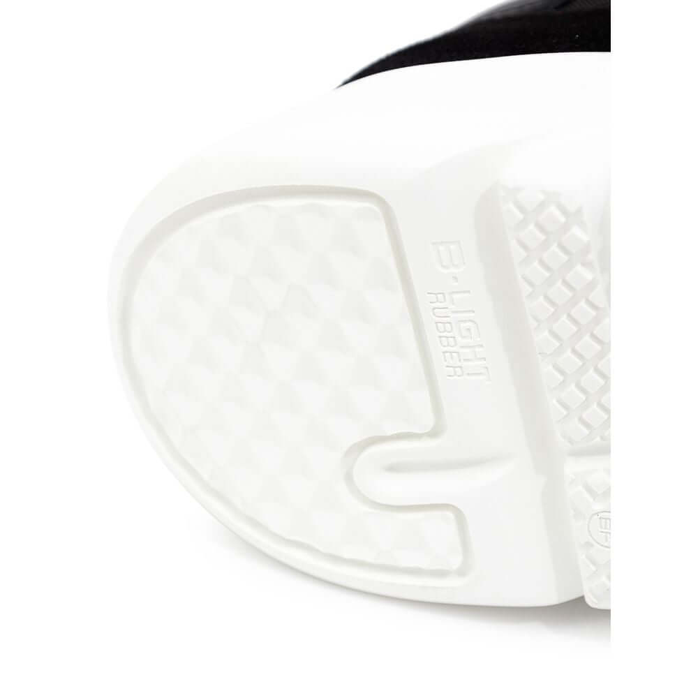 Close-up of Axel Arigato Genesis Vintage Runner sneaker sole, featuring B-Light rubber texture for enhanced grip and comfort.