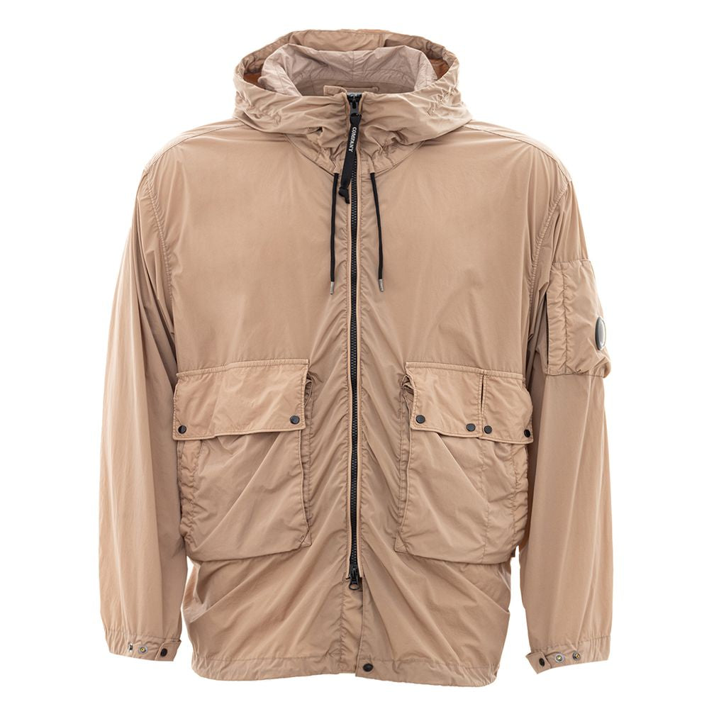 C.P. Company beige polyamide jacket with hood and front pockets, offering a sleek and durable urban style for contemporary wear.