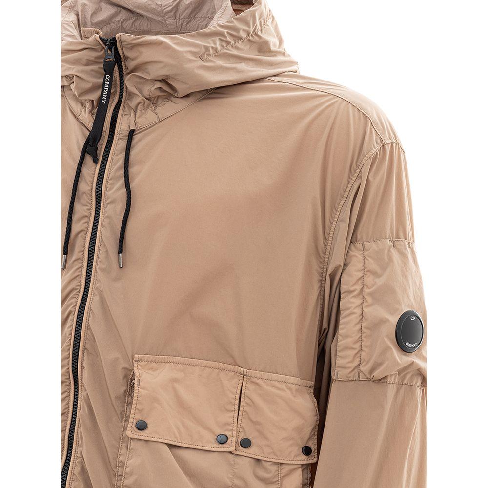 C.P. Company beige polyamide jacket showcasing durable material and urban style design elements.