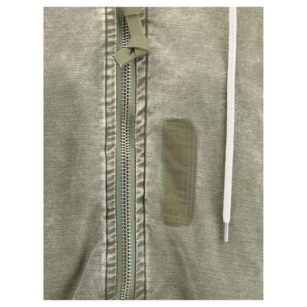 Close-up of Maison Mihara Yasuhiro hooded jacket showcasing zipper detail and drawstring in khaki cotton.
