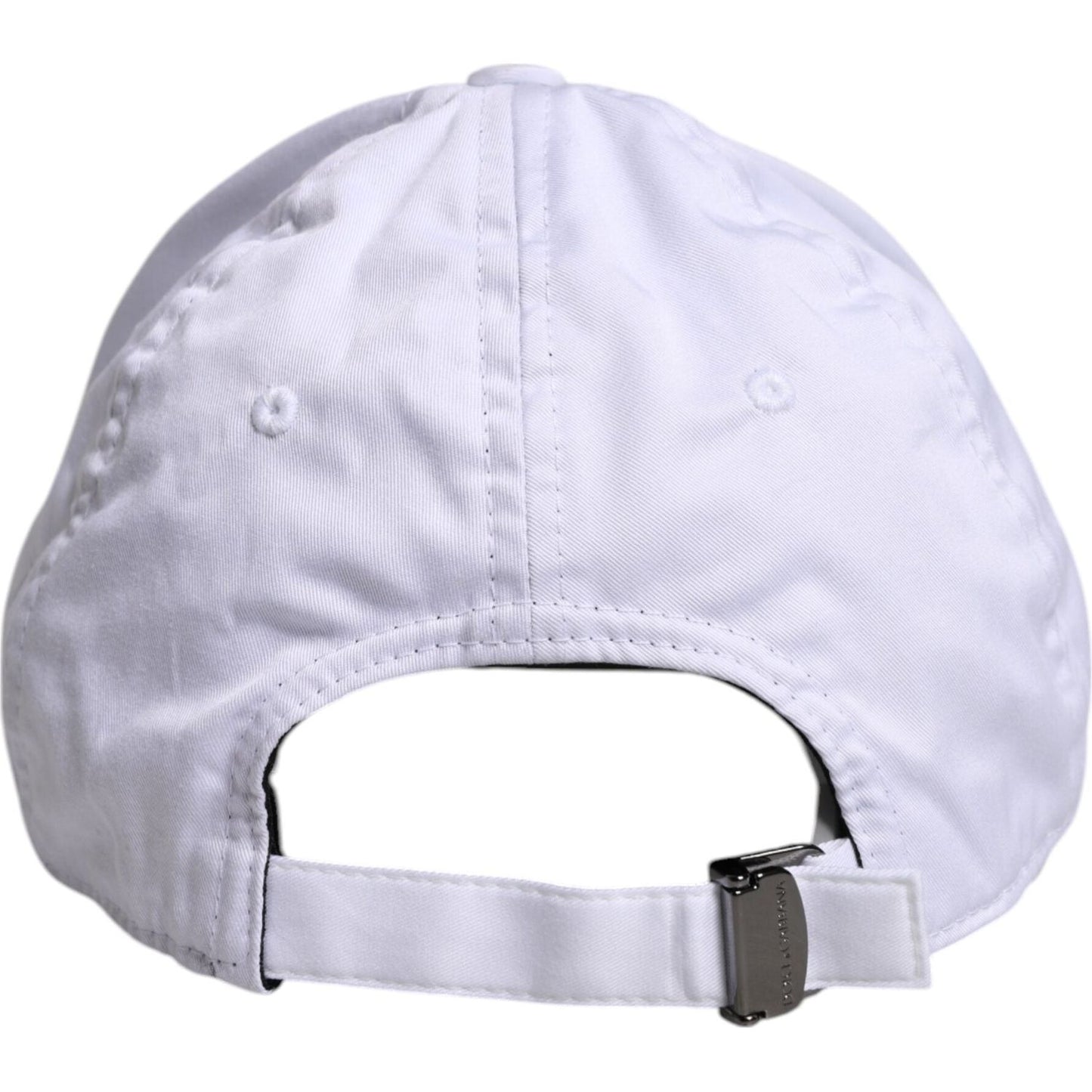Back view of Dolce & Gabbana white baseball cap with adjustable strap and minor stains, featuring DG logo plaque. Made in Italy. 97% cotton.