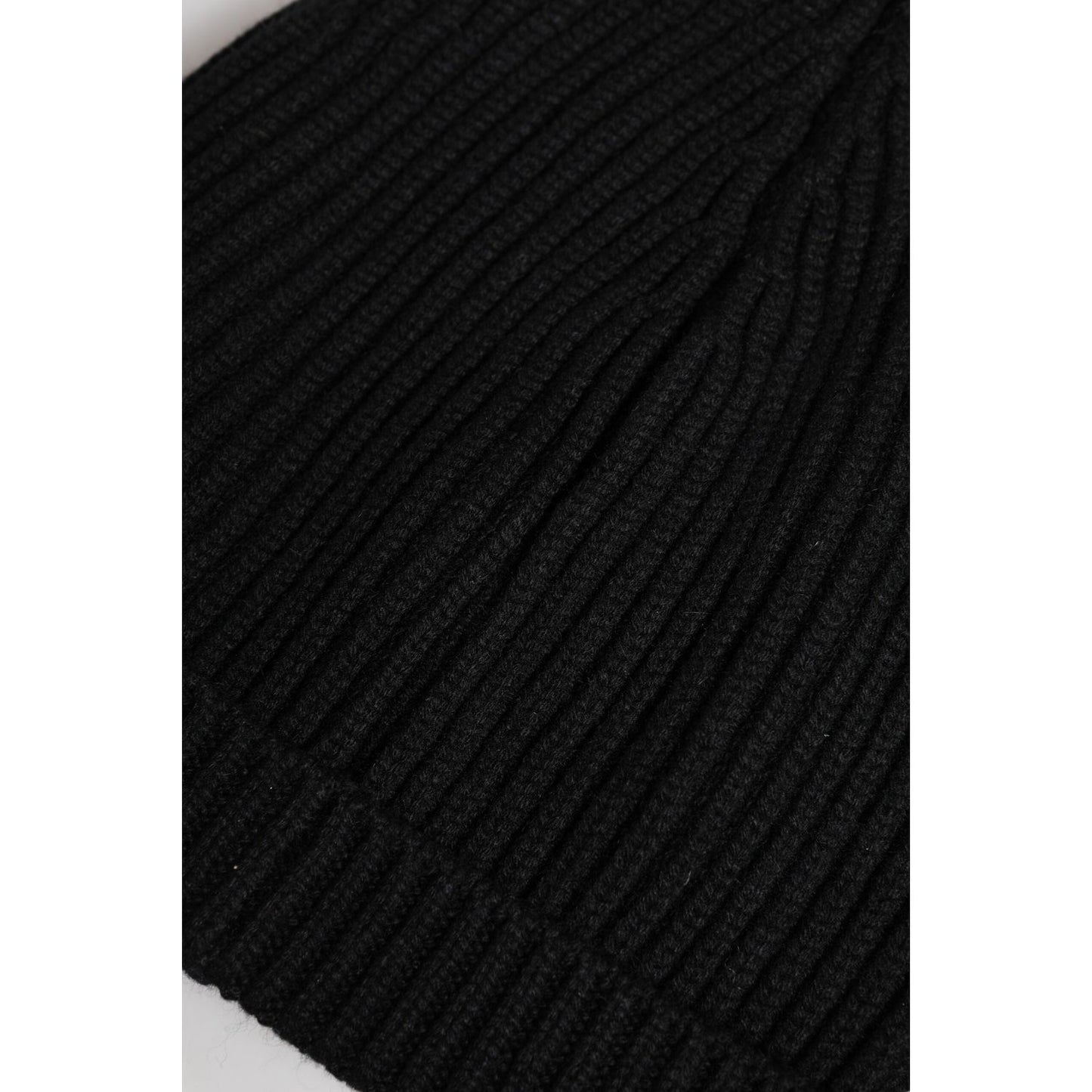 Dolce & Gabbana black cashmere knitted winter beanie hat, close-up view, 100% cashmere, Italian-made, ribbed knit design.